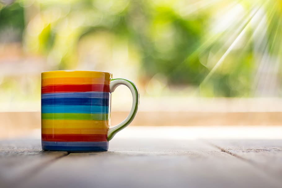 white, multicolored, rainbow print, ceramic, mug, cup, top, view, coffee, table