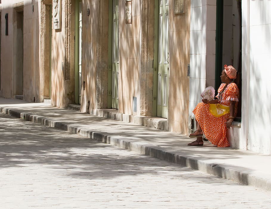 wearing, red, dress, sitting, gray, concrete, wall, Havana, Cuba, Woman, Cuban
