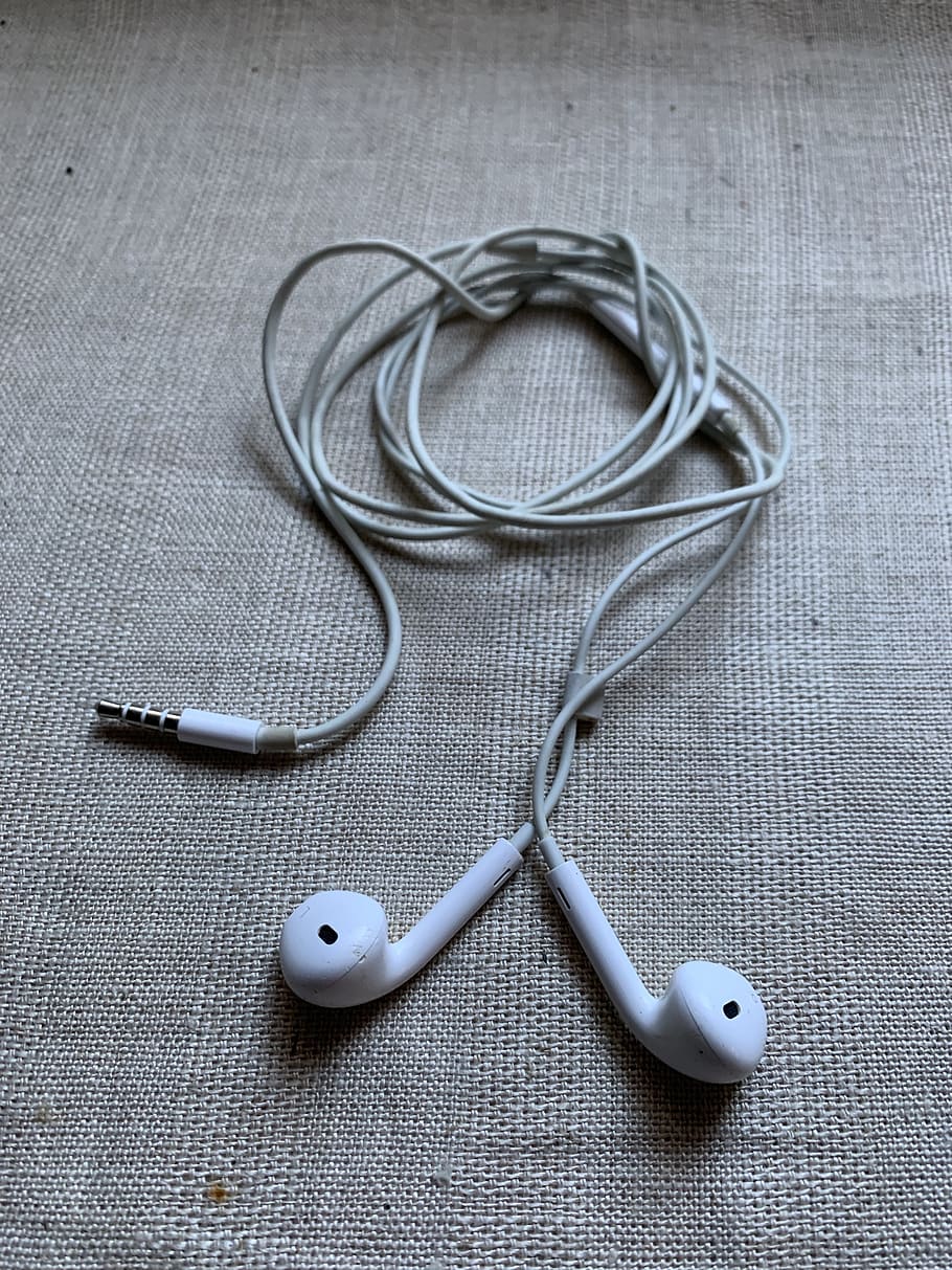 headphones, pods, apple, music, indoors, technology, studio shot, connection, high angle view, close-up