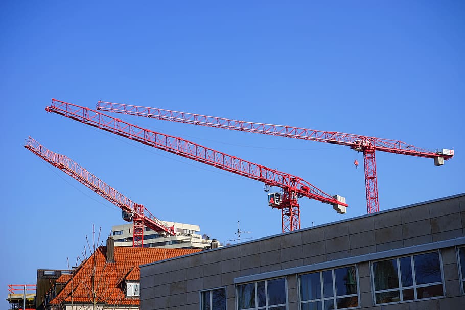 Construction Cranes, cranes, site, construction work, red, laying out, crane boom, above the rooftops of ulm, ulm, new ulm