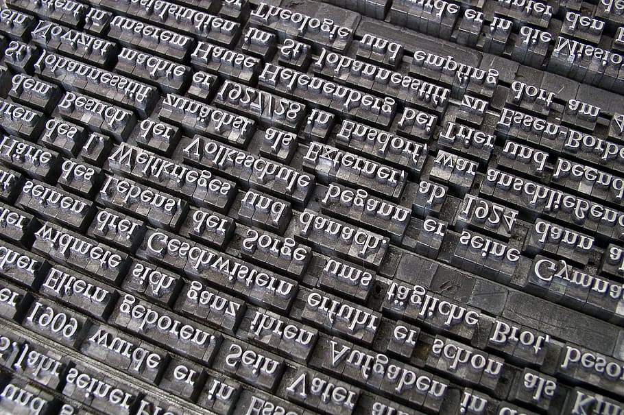 closeup, text encarved panel, font, lead set, book printing, gutenberg, letters, hand set, font composing room, typecases