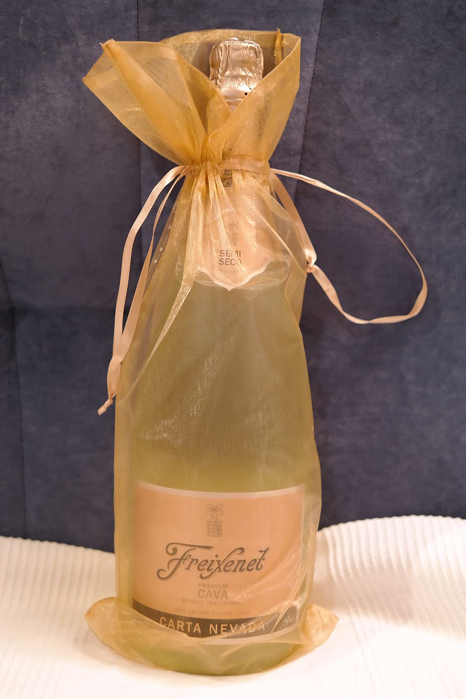 freixenet carta nevada bottle, brown, drawstring pouch, champagne, gift, loop, packed, golden, freixenet, bottle of sparkling wine