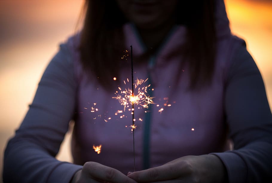 woman, holding, fire cracker, selective, focus photography, sparkler, lights, fire, flame, blur