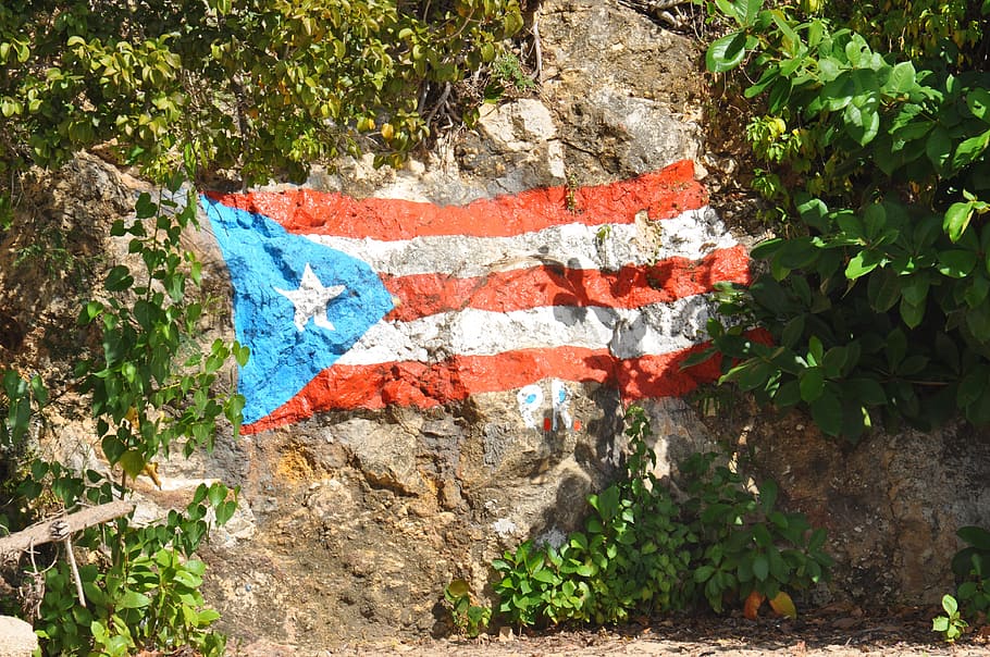 cuba paint flag, rock, puerto rico, mountain, rock wall, flag, shrubs, plant, day, nature