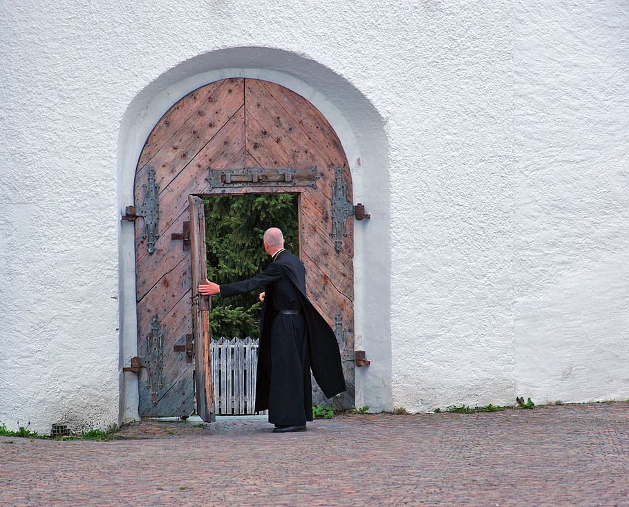 man standing door, father, convent, door, hospitality, friar, abbey, friendly, welcome, goalkeeper