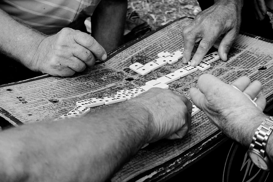 grayscale photography, person, touching, cube, game, play, dices, hands, gambling, domino