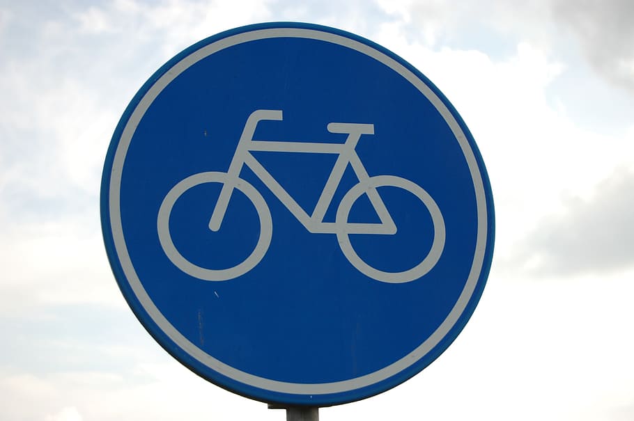 bicycle signage, road sign, bike path, bicycle, board, road safety education, traffic situation, cloud - sky, circle, communication