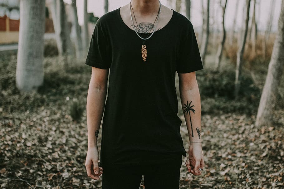 selective, focus photography, person, wearing, black, scoop-neck t-shirt, standing, dried, leaf ground, outdoors