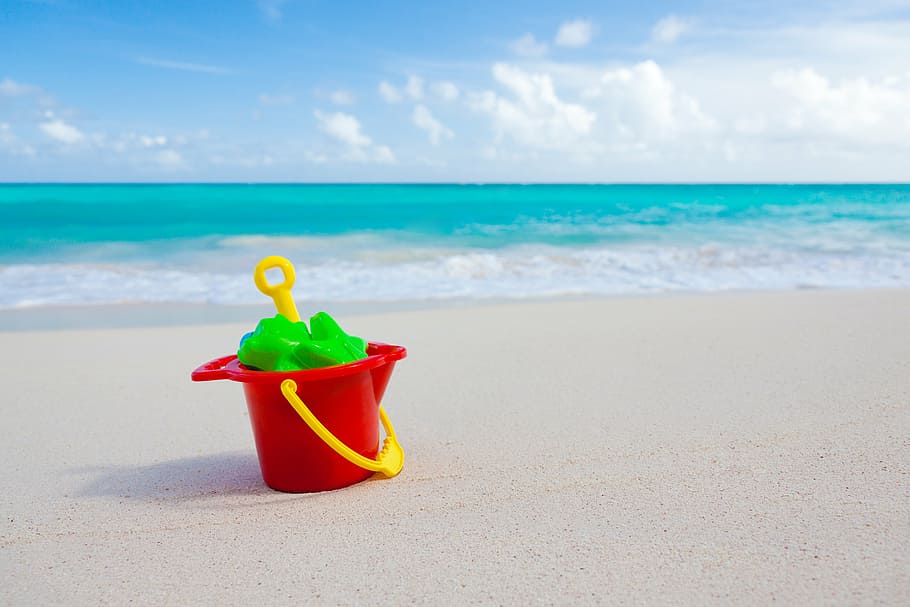 red, yellow, plastic pail, shovel, ocean, sand, bucket, beach, vacation, summer