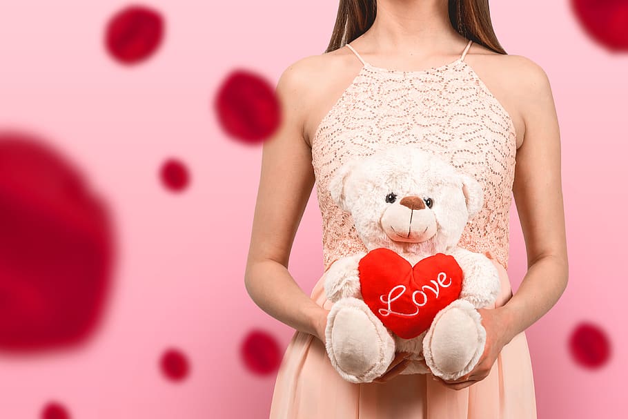 young, girl, dress, holding, teddy, bear, heart, love., Pink, background.