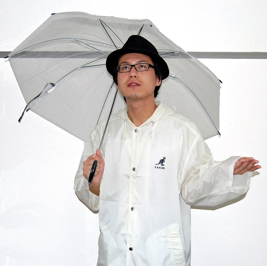 male, person, umbrella, rain coat, vinyl, nylon, hat, glasses, rainy season, face