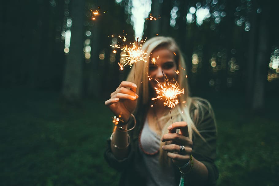 depth, field photography, woman, holding, two, sparklers, depth of field, photography, girl, fireworks