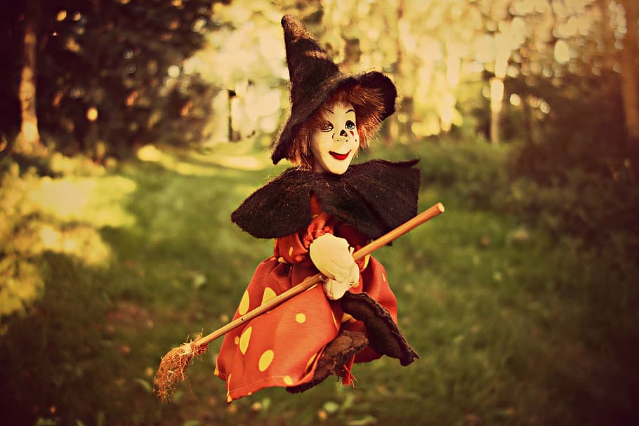 child, witch costume, riding, broomstick, daytime, witch, broom, witch hat, doll, toy