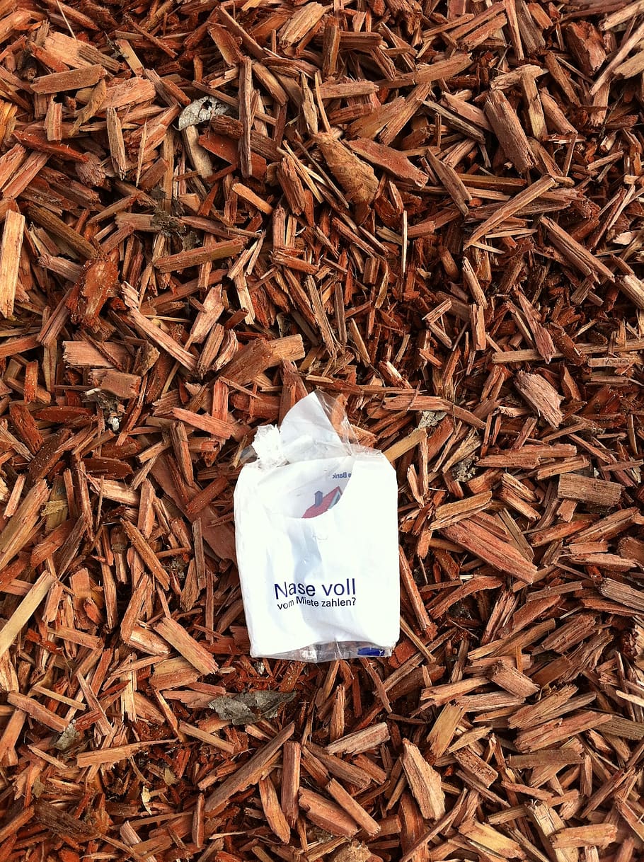 bark mulch, advertising, handkerchief, garbage, nose full, nose, text, high angle view, western script, communication