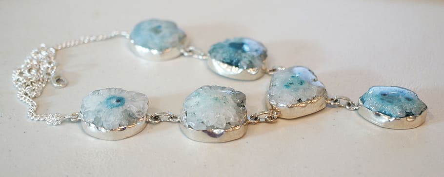 silver-colored teal stone necklace, white, board, solar quartz geode, stone, necklace, blue, gem, gemstone, natural