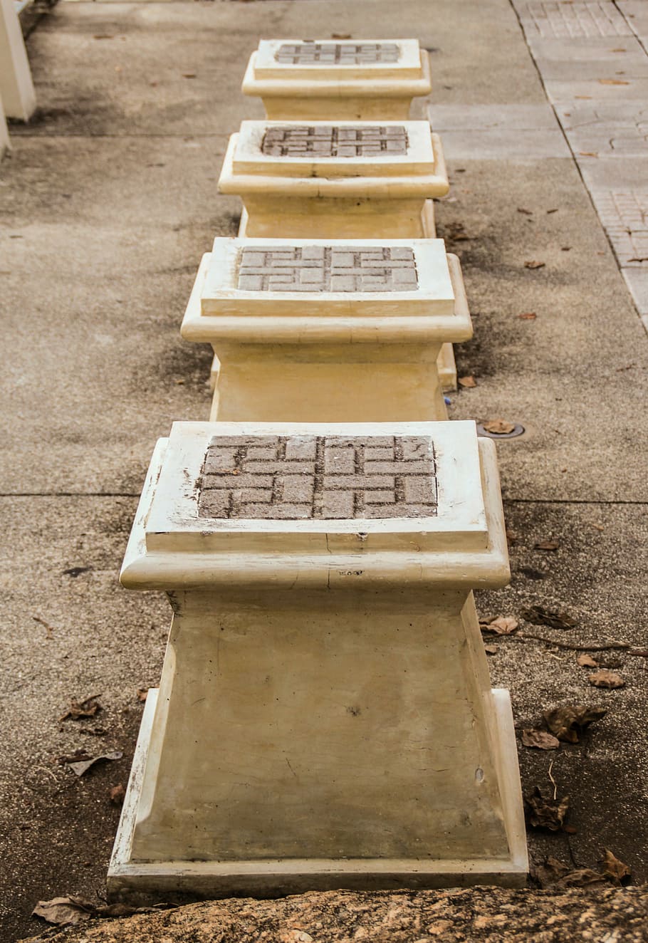 socket, seat, stone, stool, building, day, high angle view, outdoors, in a row, focus on foreground