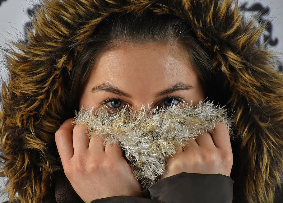 woman, wearing, brown, black, parka jacket, winter, hood, faux fur, scarf, wool scarf