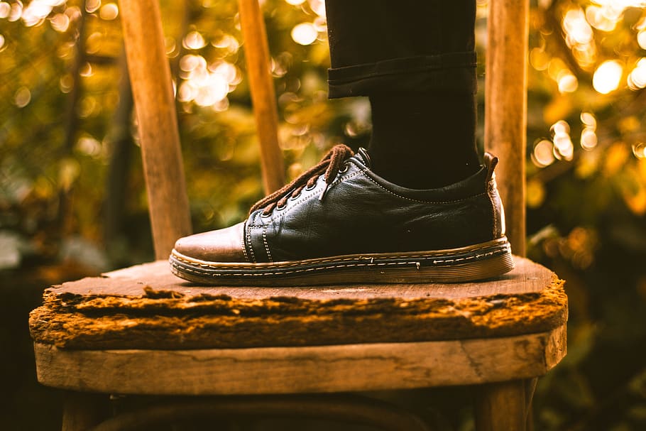 footwear, shoe, black, sock, chair, bokeh, blur, focus on foreground, close-up, outdoors