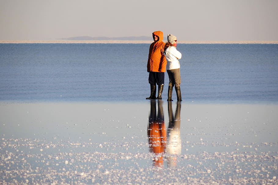 reflection, water, landscape, uyuni salt flat immensity, peaceful, sea, full length, togetherness, sky, horizon