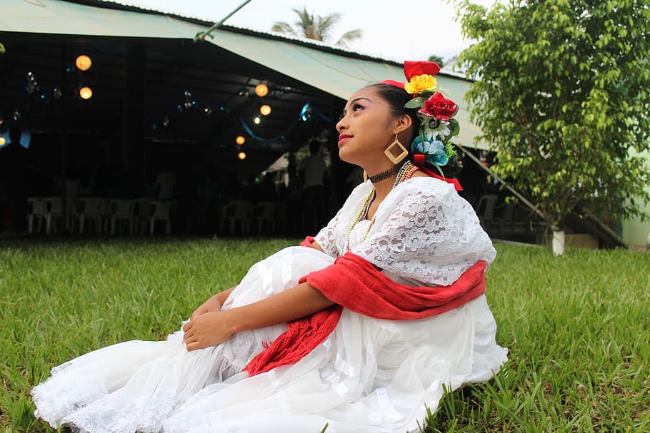 woman, wearing, white, dress, red, scarf, sitting, grass, daytime, mexico