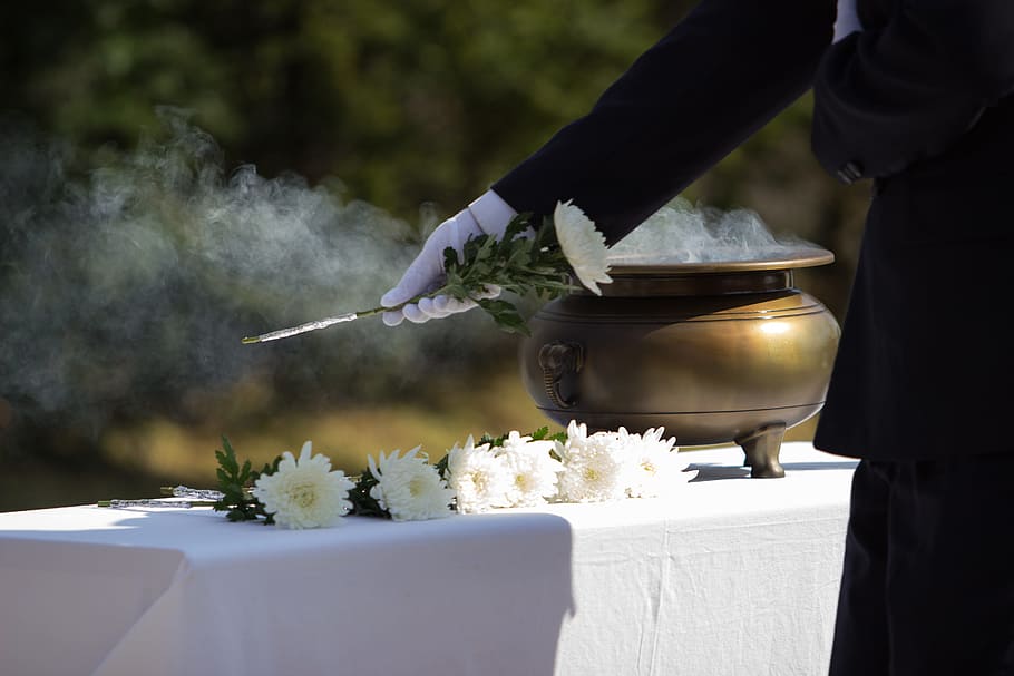 incense, memorial, wreath, chrysanthemum, one person, smoke - physical structure, food, holding, midsection, food and drink