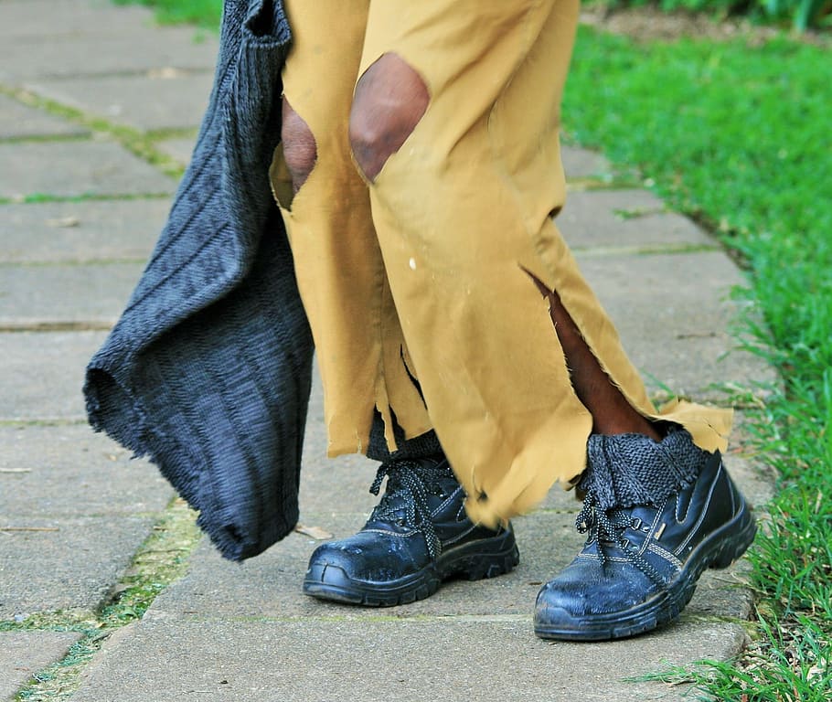 person, wearing, distressed, yellow, pants, black, boots, hobo, vagrant, homeless
