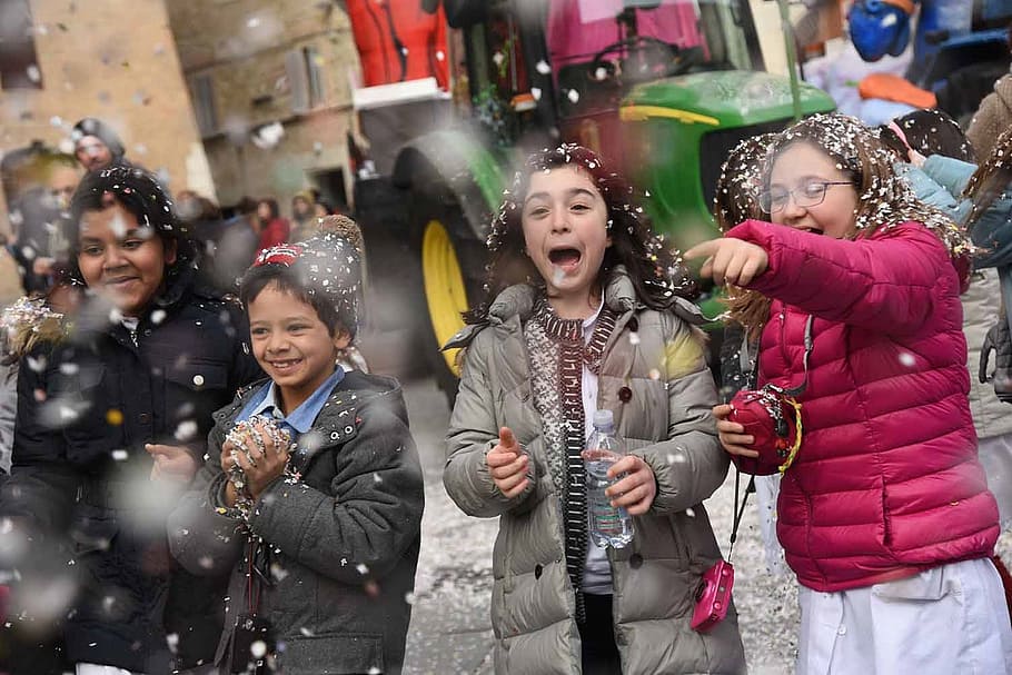 children playing snow, carnival, masks, fun, children dressed, winter, warm clothing, group of people, happiness, cold temperature