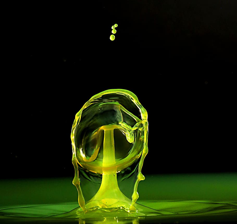 water drop, droplet, splash, yellow, studio shot, green color, black background, copy space, transparent, indoors