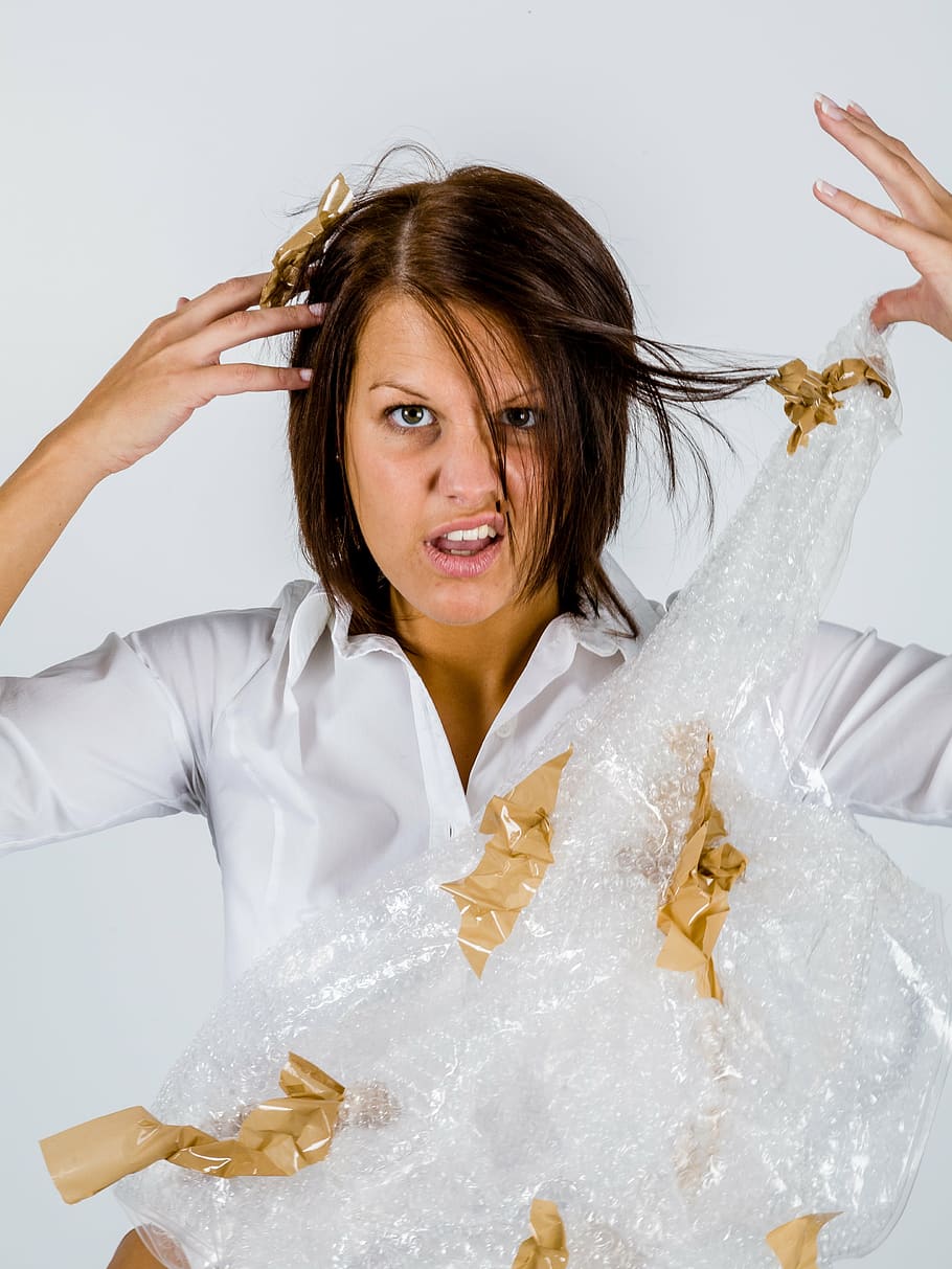 woman, white, top, holding, bubble, wrap, office, packaging, tape, frustration