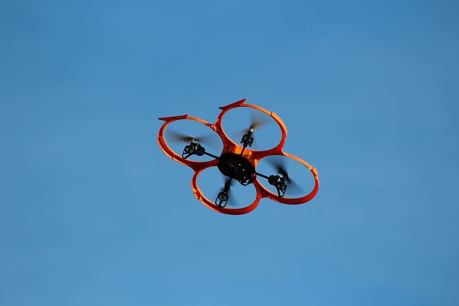 red quadcopter, drone, flying object, model, remotely controlled, rotors, multicopter, sky, blue, clear sky