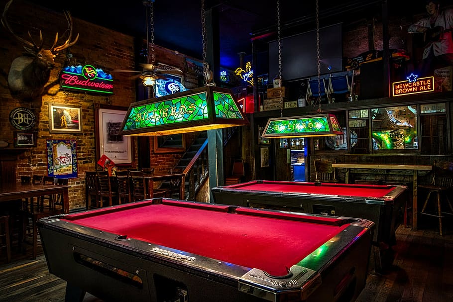 two, red-and-brown pool tables, inside, room, brown, wooden, desk, billiards, pool tables, bar