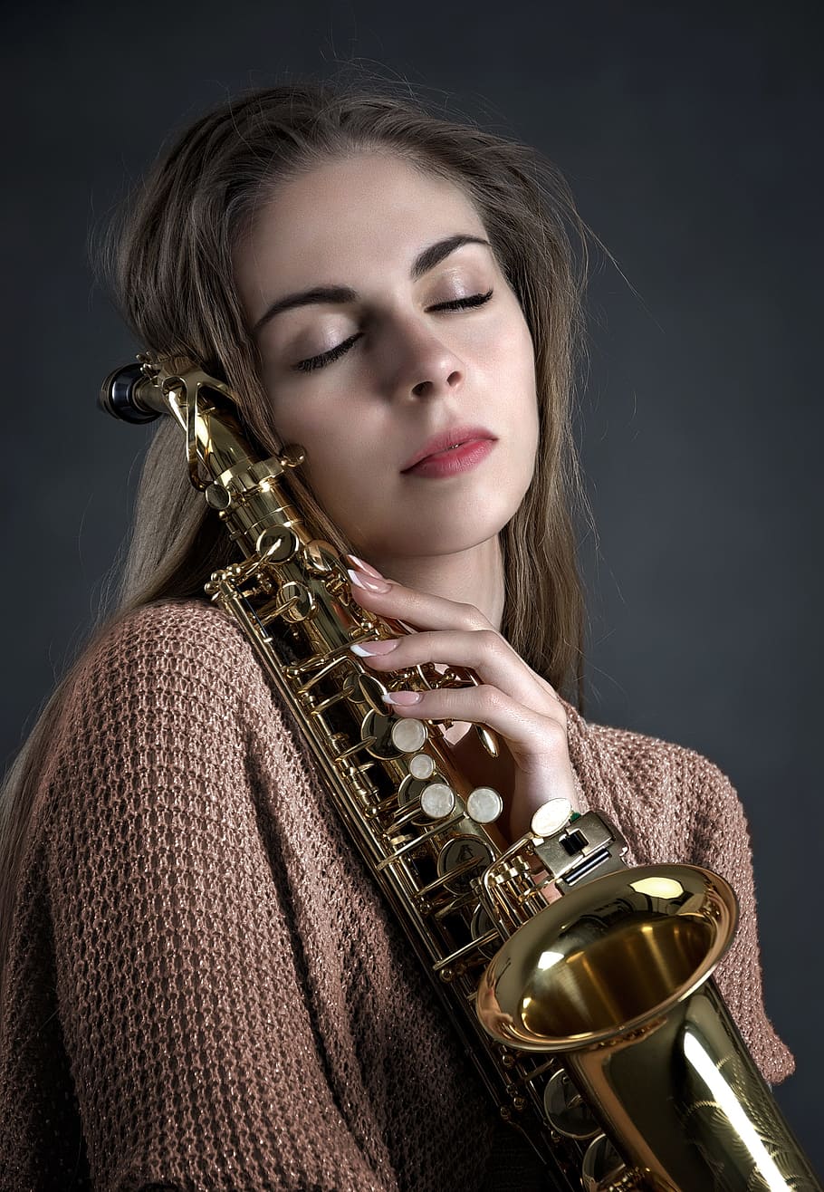 woman, holding, brass-colored saxophone, girl, music, saxophone, instrument, playing, brunette, listen