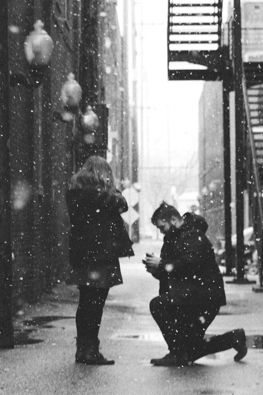 man, kneeling, front, woman, black and white, people, couple, propose, love, snow