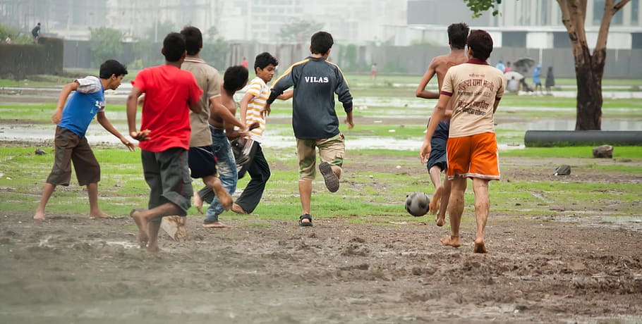 boys playing soccer, football, slush, soccer, muddy, mud, children, kids, playing, rain