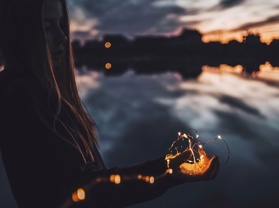 selective, focus photography, woman, holding, string light, dark, cloud, sky, reflection, people