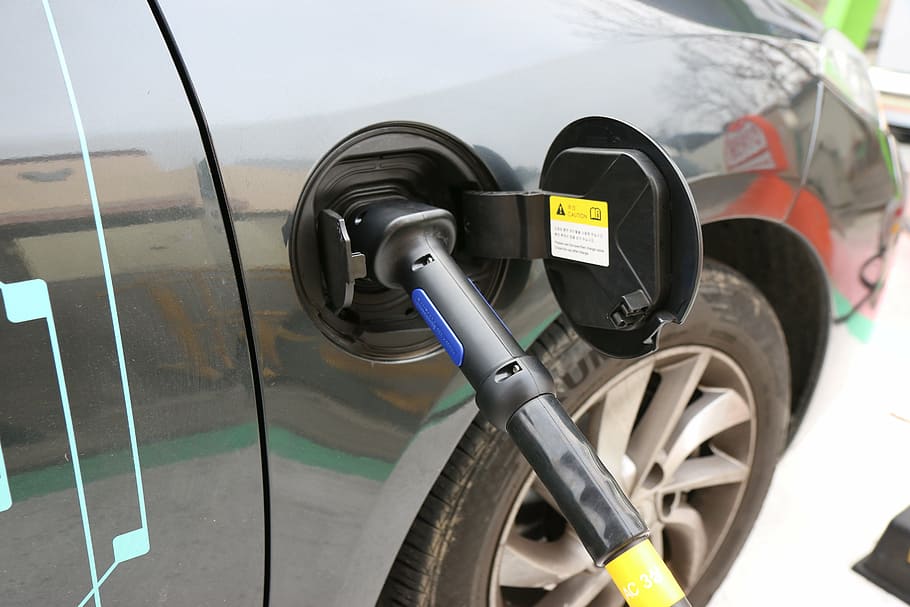 gasoline nozzle, electric cars, charging, concent, transportation, mode of transportation, land vehicle, fuel and power generation, refueling, close-up
