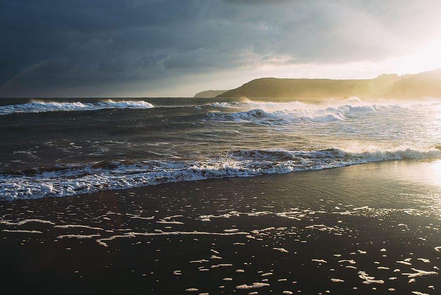 photo of seashore, blue, body, water, sunset, beach, ocean, sea, waves, shore