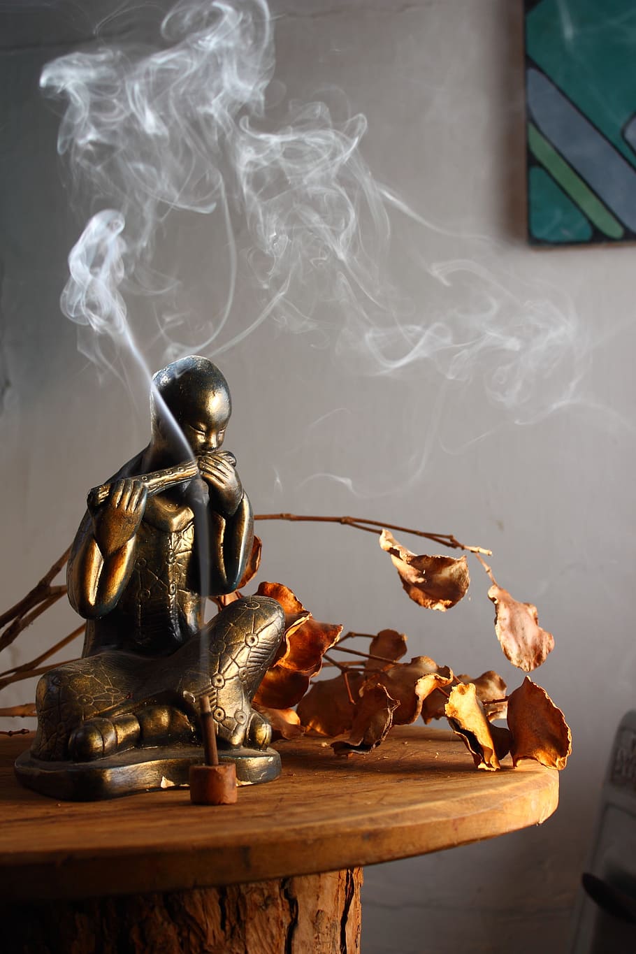 male, sitting, figurine, top, brown, table, buddha, statue, incense, smoke