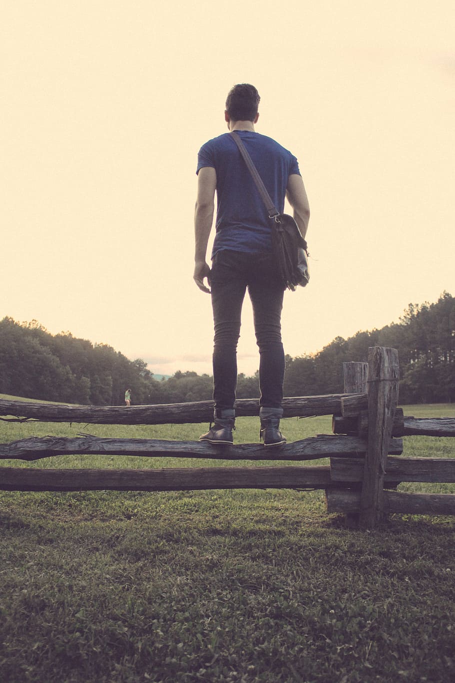 man, stands, gray, wooden, fence, daytime, standing, wood, plank, facing