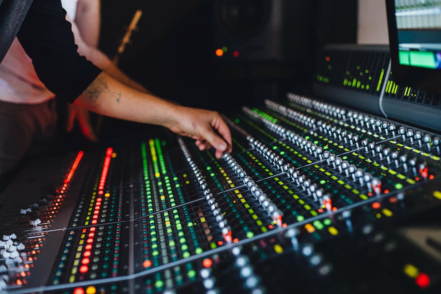 closeup, photography, person, using, mixing, console, control panels, controls, equipment, hand