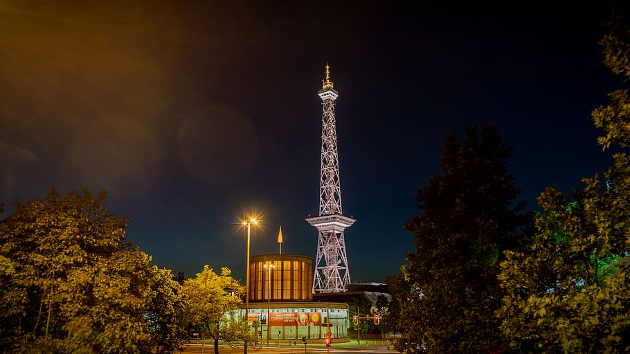 night photograph, long exposure, radio tower, berlin, fairgrounds, illuminated, tower, high, steel truss tower, a long stretch