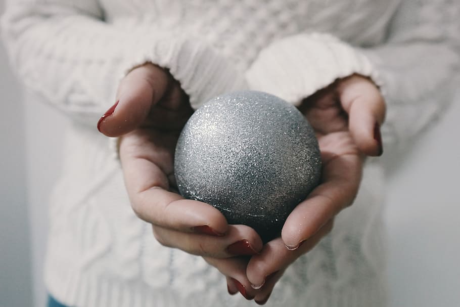 christmas, ball, decoration, glitters, sliver, hand, holding, one person, human hand, focus on foreground