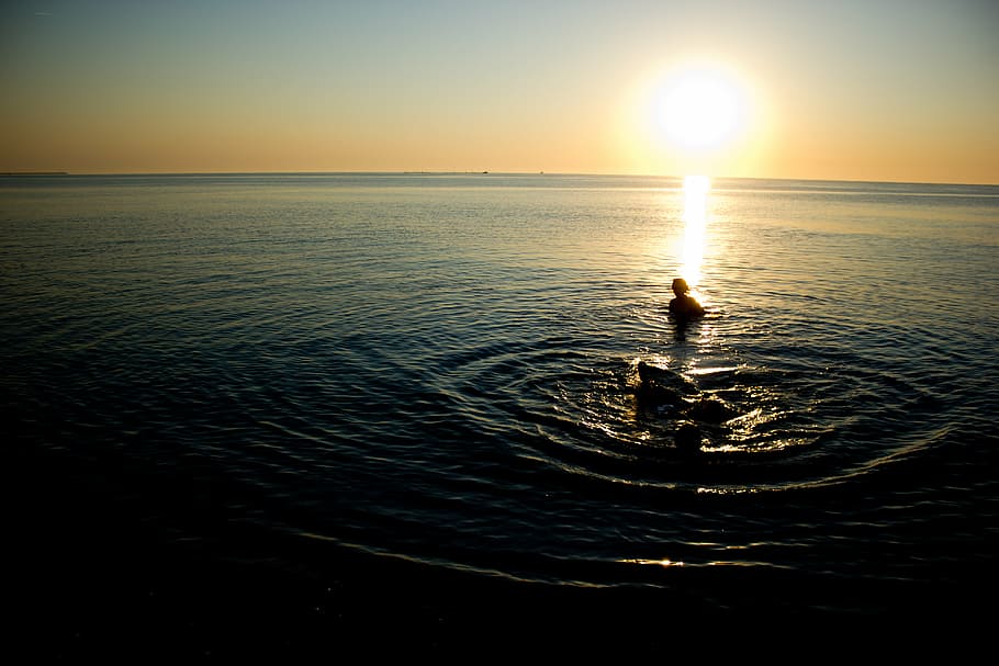 body, water, yellow, sky, person, ripping, sea, dusk, ocean, sunset