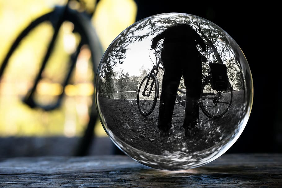 cyclists, glass ball, photo sphere, bike, globe image, close-up, focus on foreground, reflection, wood - material, day