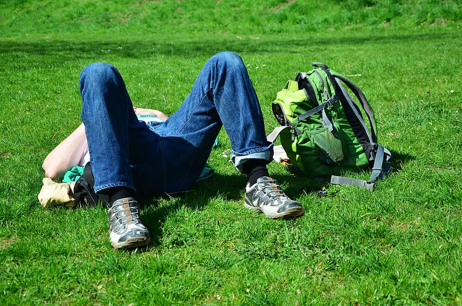 person, lying, green, grass, backpack, relax, rest, break, meadow, relaxation