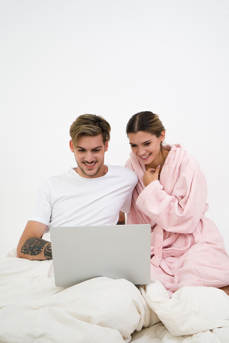 couple, smiling, bed, notebook, watching, woman, man, happy, young, happiness