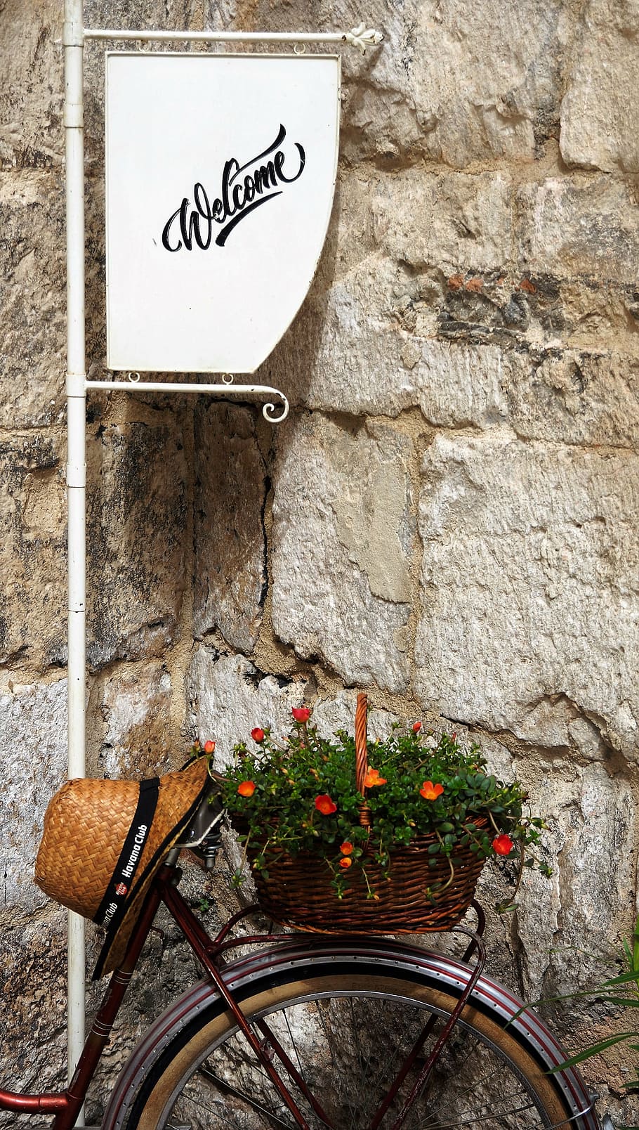 bicycle, welcome, flowers, hat, croatia, sign, street, wall - building feature, text, communication