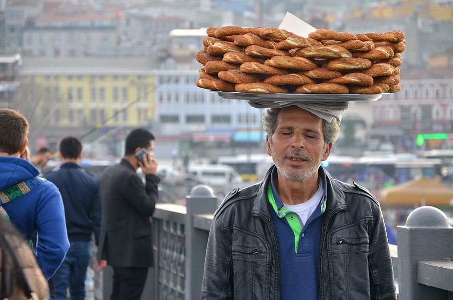 man, black, leather zip-up jacket, tray, bread, head, daytime, bagel, istanbul, human