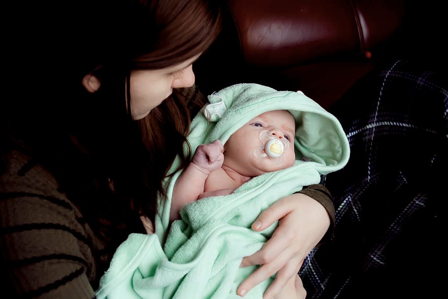 woman, holding, baby, covered, green, textile, people, girl, child, mother