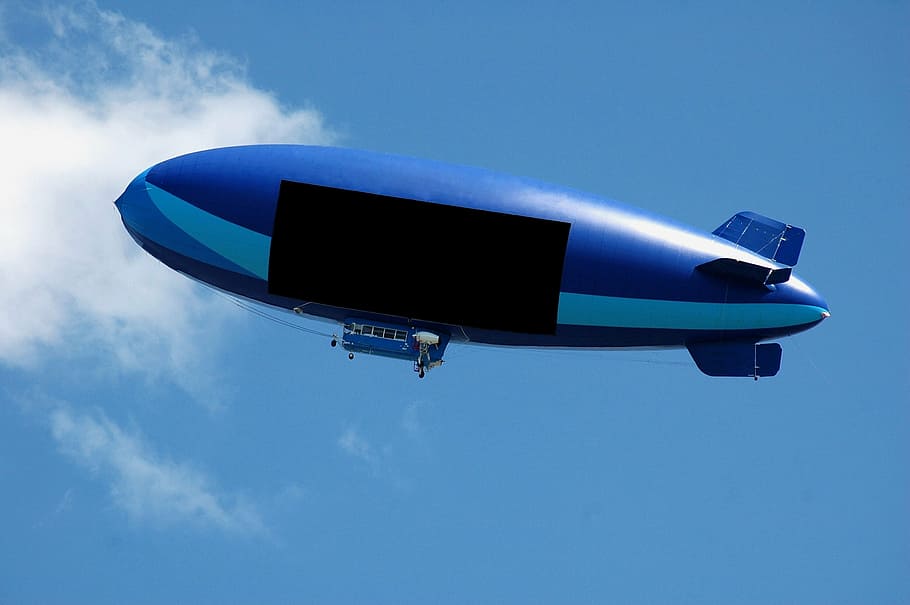 blue zeppelin, blimp, air ship, balloon, text space, advertisement, advertise, transportation, vehicle, travel